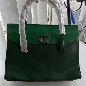 NEW: Two bags in one : Chriskalla Green Leather Handbag
Has never been used .